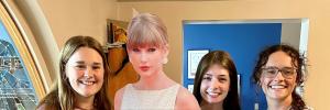 interns with Taylor Swift carboard cutout